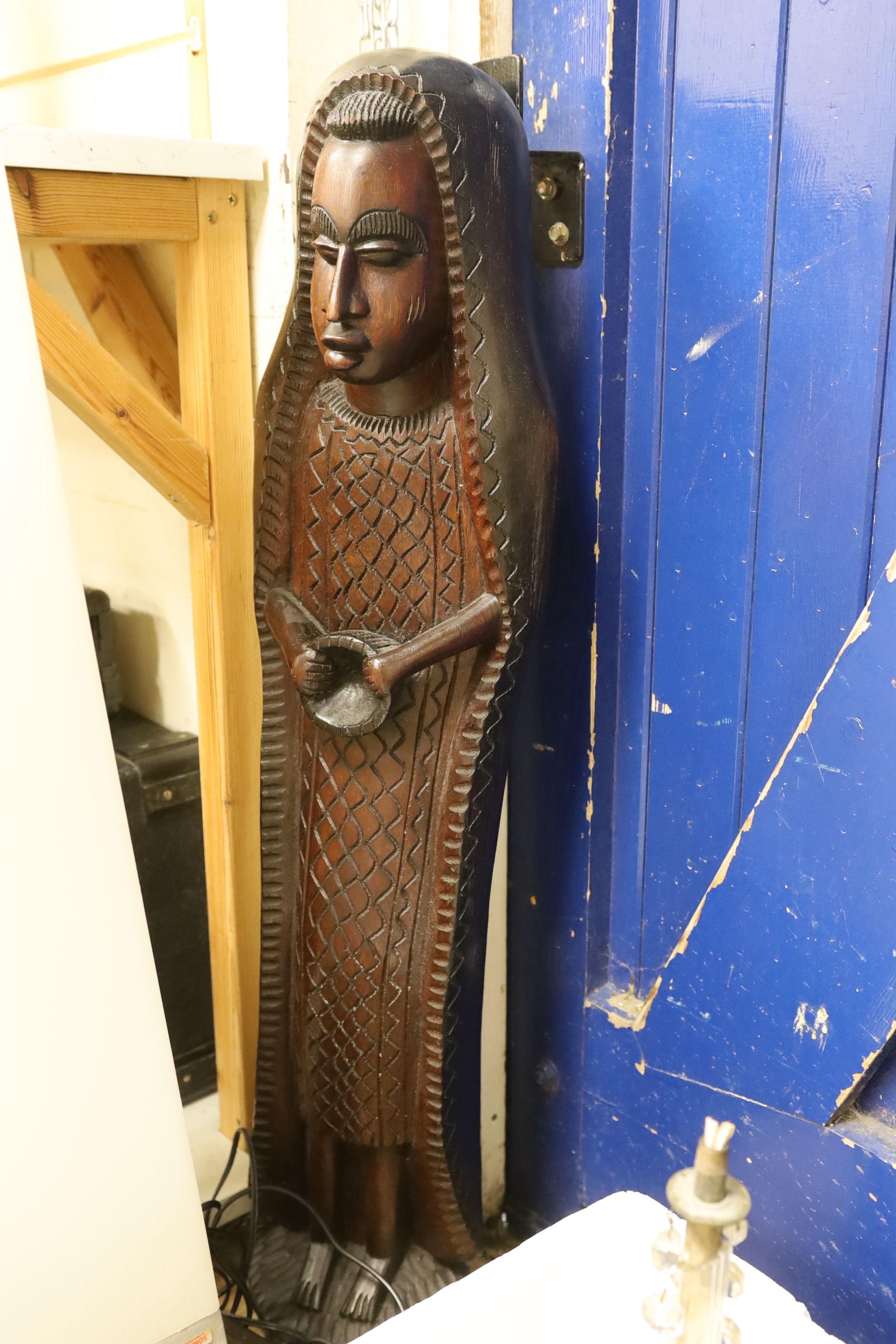 A pair of large African hardwood figural carvings and a Mathmos floor lamp